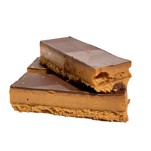 Classic caramel slice with a biscuit base, layered with golden caramel, and topped with a thick layer of chocolate.