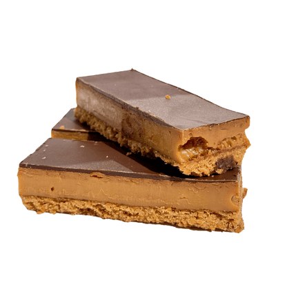 Classic caramel slice with a biscuit base, layered with golden caramel, and topped with a thick layer of chocolate.