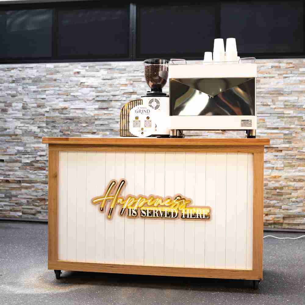 Live dessert cart with coffee machine on it. 