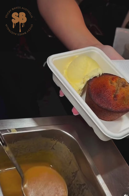 Video of sticky date pudding and vanilla ice cream being topped with warm butterscotch sauce. 