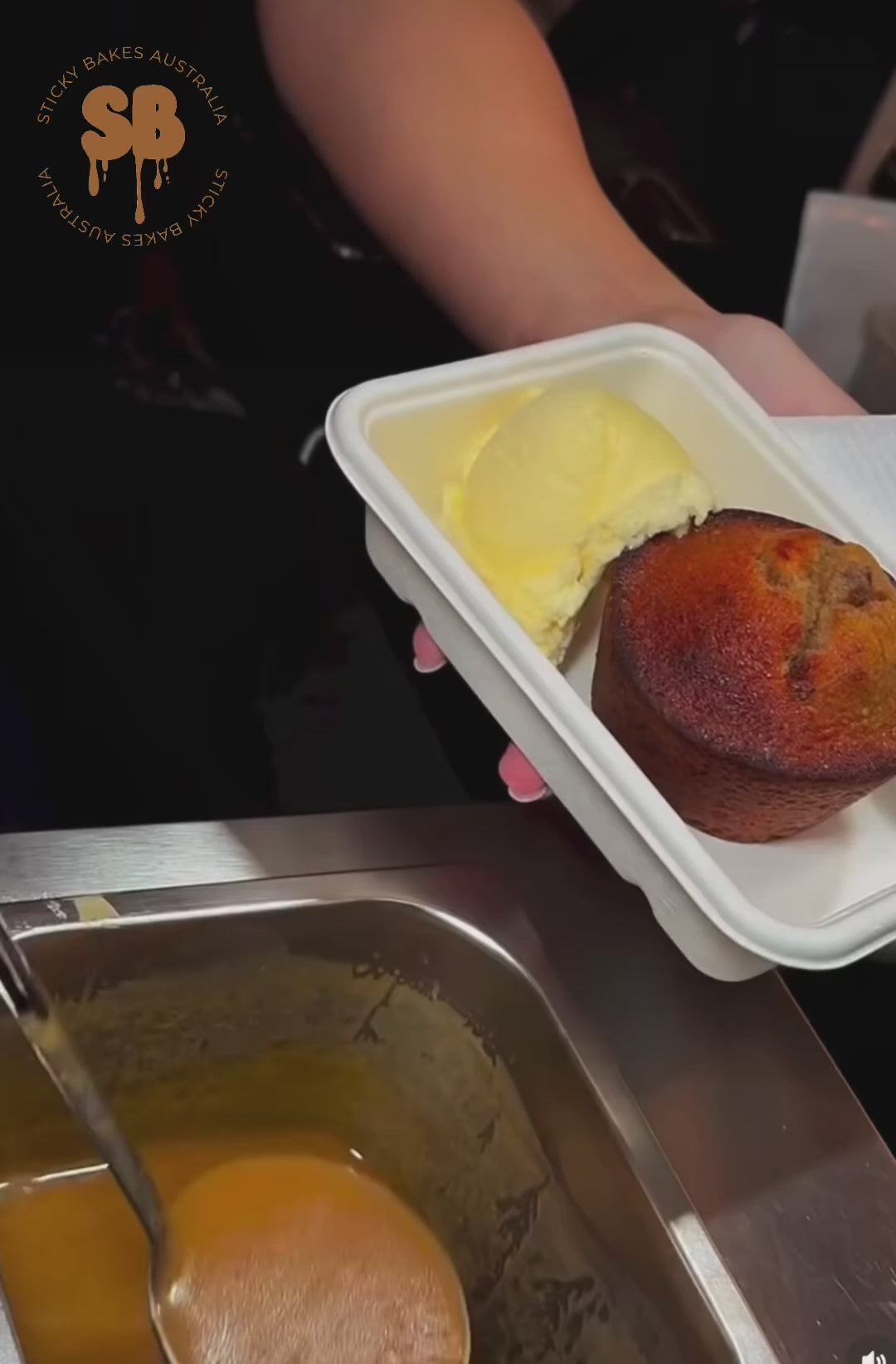 Video of sticky date pudding and vanilla ice cream being topped with warm butterscotch sauce. 